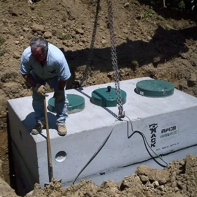 precast concrete septic tank being installed