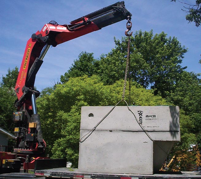 crane delivering pre-cast concrete products